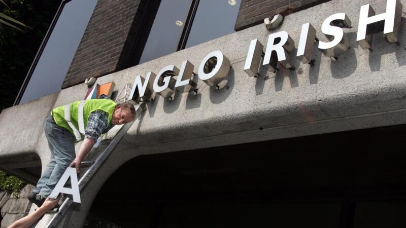 The Anglo Irish Bank signage is removed from the former bank premises at St Stephen’s Green Dublin. Photograph: Matt Kavanagh /The Irish Times
