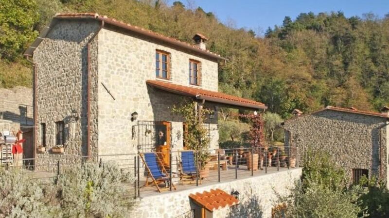 Tuscan home with garden set in chestnut and olive groves overlooking a valley, 100sq m house is traditional in style with exposed stone walls