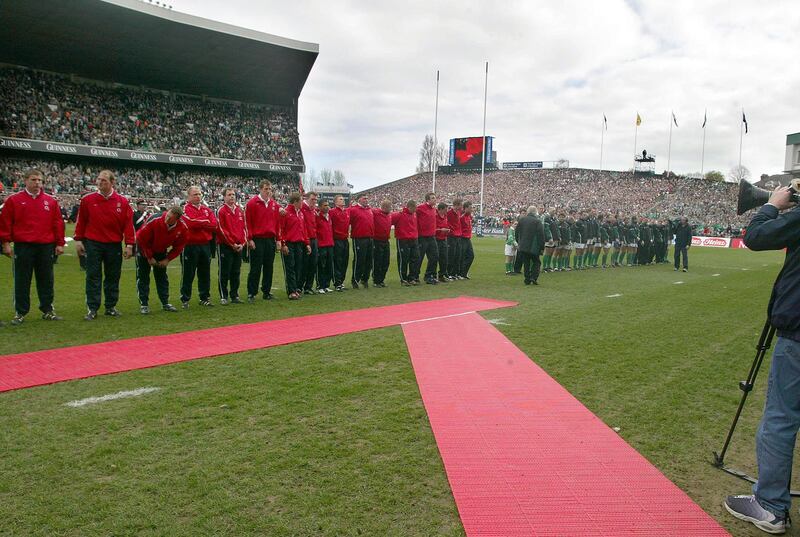 Walk over: The English team break with protocol by refusing to stand in the correct place. They went on to win 42-6. Photograph: Lorraine O'Sullivan/Inpho