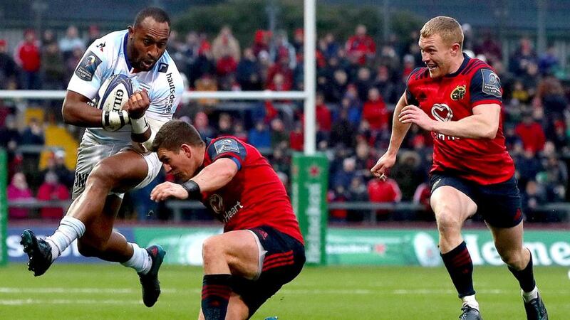 Joe Rokocoko of Racing 92 tries to run through the attempted tackle of Munster’s Ian Keatley as Keith Earls also closes in during the Champions Cup game at Thomond Park. Photograph: Bryan Keane/Inpho