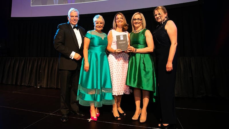 Claire O'Reilly, Awards Judge, presents the Most Effective Employee Engagement Strategy award to the DPD Ireland team.