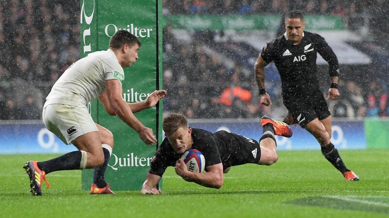 Damien McKenzie scores for the All Blacks against England. Photograph: Shaun Botterill/Getty