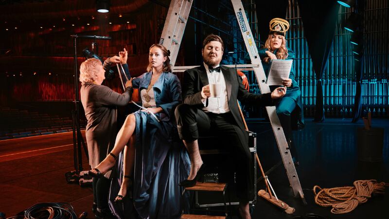 Anne Reck, Wexford Festival Opera wardrobe supervisor with artists Jade Phoenix, Rory Dunne and Ioana Pipelea on the stage of the National Opera House, ahead of this year's Wexford Festival Opera. Photograph: Patricio Cassinoni