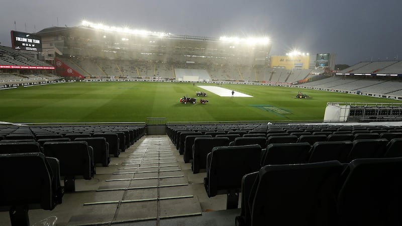 Rain brought a premature end to day two at Eden Park. Photograph: Fiona Goodall/AFP