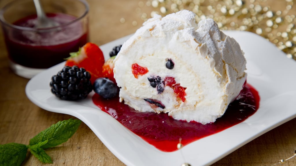 Meringue roulade with mixed berry coulis. Photograph: Harry Weir