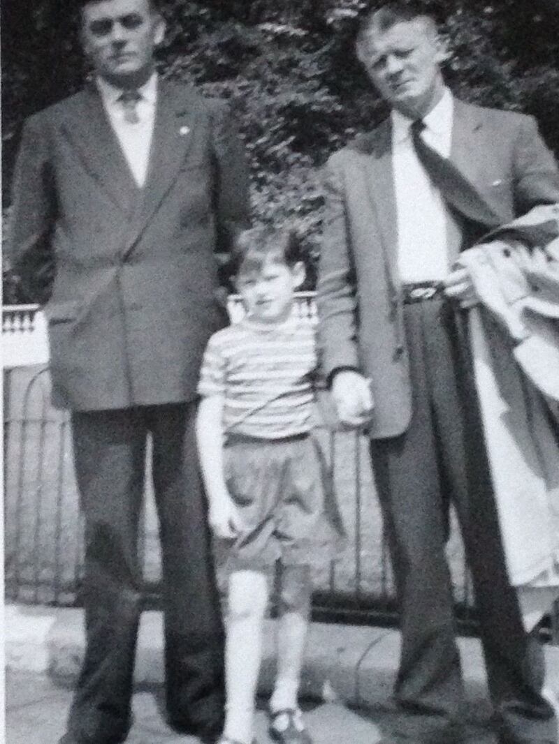 Ian Duhig holding the hand of his father Robert, with his uncle Paddy