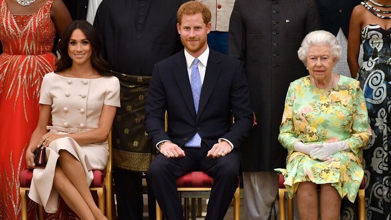 Queen Elizabeth, Prince Harry and Meghan at the Queen’s Young Leaders Awards Ceremony, in London, June 26th, 2018. Photograph: John Stillwell/Pool via Reuters