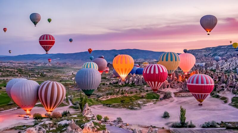 A hot air balloon trip over the magical landscape of Cappadocia is an unforgettable experience.
