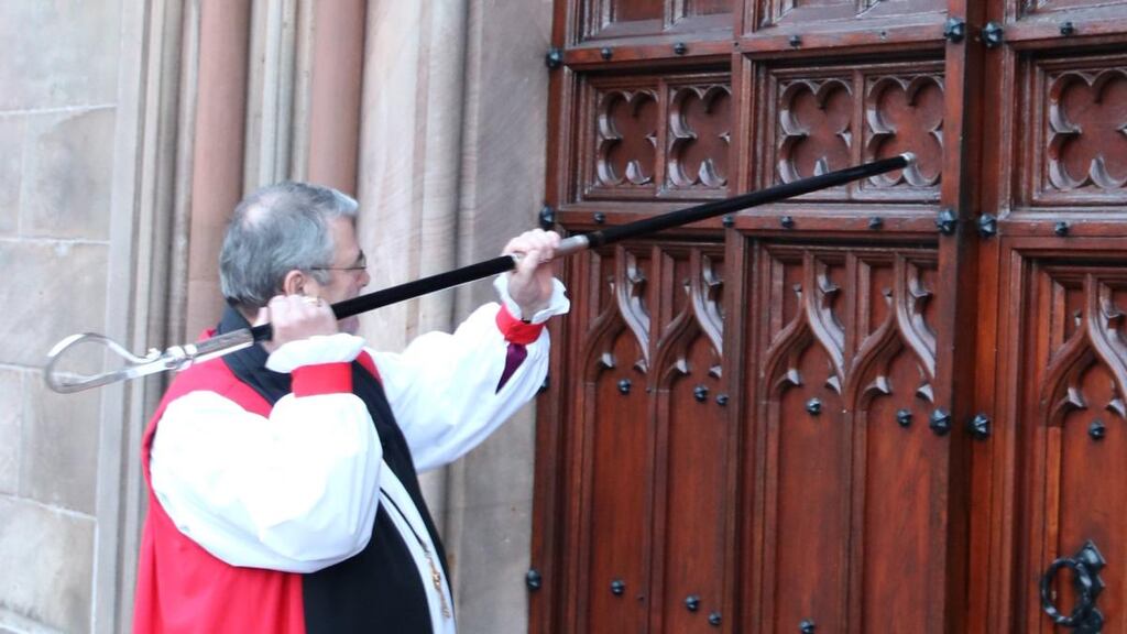 Archbishop John McDowell knocks on the door of St Patrick’s Cathedral, Armagh, with his crozier before the service of enthronement. Photograph: Church of Ireland press office