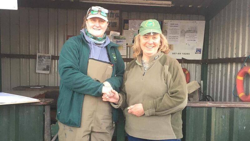 Julie Gerry, left, presenting Ruth Arrell (Derry), with her prize after winning the Leinster trial on Lough Lene