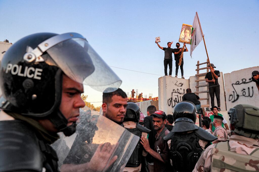 Iraqi riot police try to disperse supporters of Iraqi Shiite cleric Moqtada al-Sadr gathering for a protest outside the Swedish embassy in Baghdad on July 20th. Protesters set fire to Sweden's embassy in the Iraqi capital ahead of a planned burning of a Koran in Sweden. Photograph: Ahmad Al-Rubaye/AFP via Getty Images