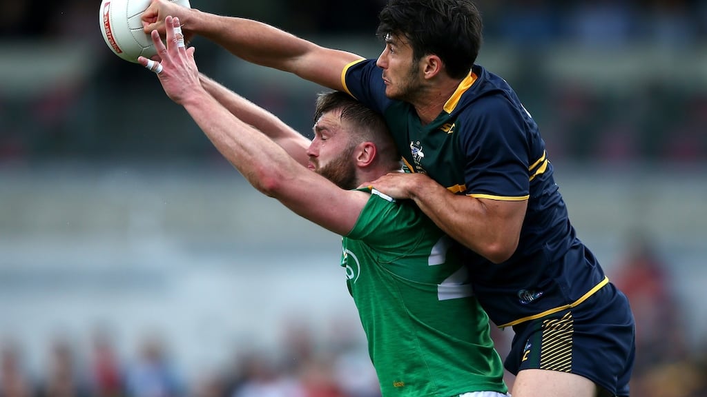 Australia’s Robbie Tarrant spoils the mark for Aidan O’Shea in the second Test of the international rules series, which ended in two defeats for Ireland. Photograph:   Paul Kane/Getty Images