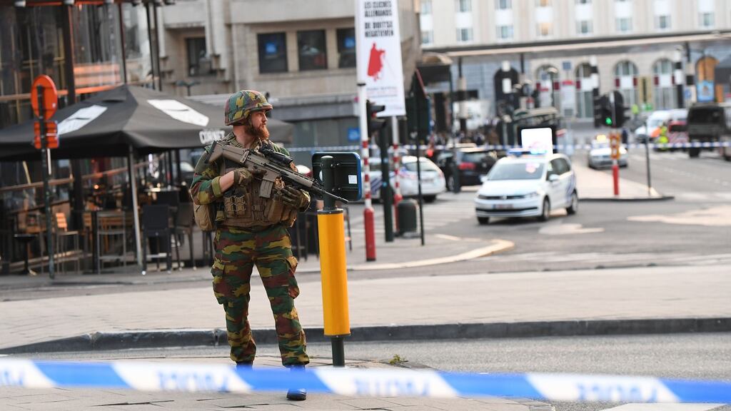 A soldier cordons off an area outside Brussels Central Station, after an explosion in the Belgian capital. Photograph: Emmanuel Dunand/AFP/Getty Images