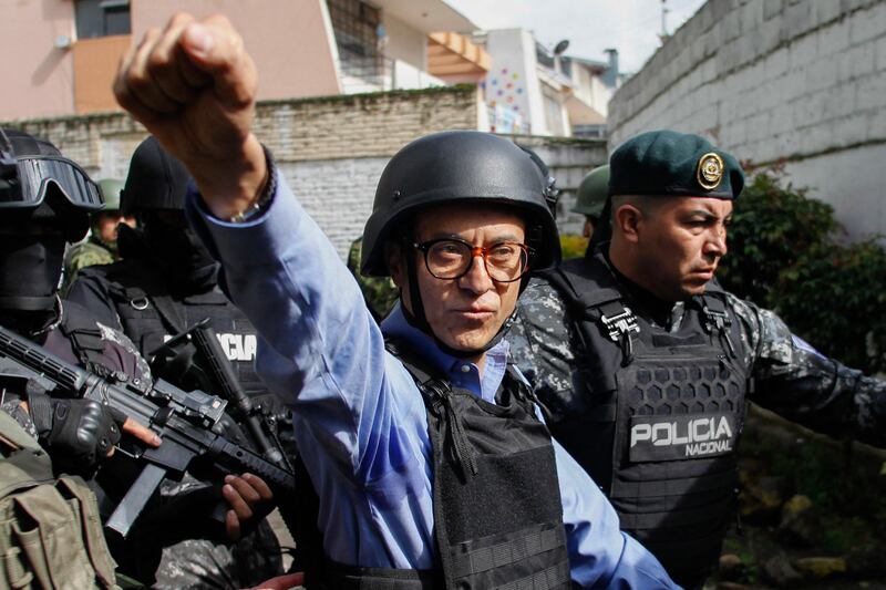 Ecuador's presidential candidate for the Construye party, journalist Christian Zurita, gestures as he leaves under heavy security after voting at a polling station in Quito on Sunday. Photograph: by Galo Paguay/AFP via Getty Images