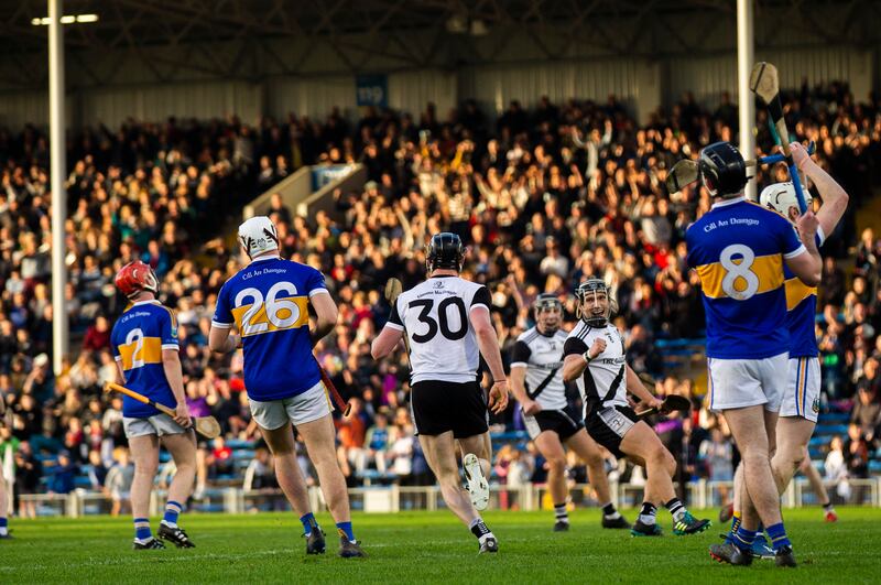 Kilruane MacDonaghs' Jerome Cahill (number 30) celebrates after scoring his side's second goal of the match. Photograph: Tom Maher/Inpho