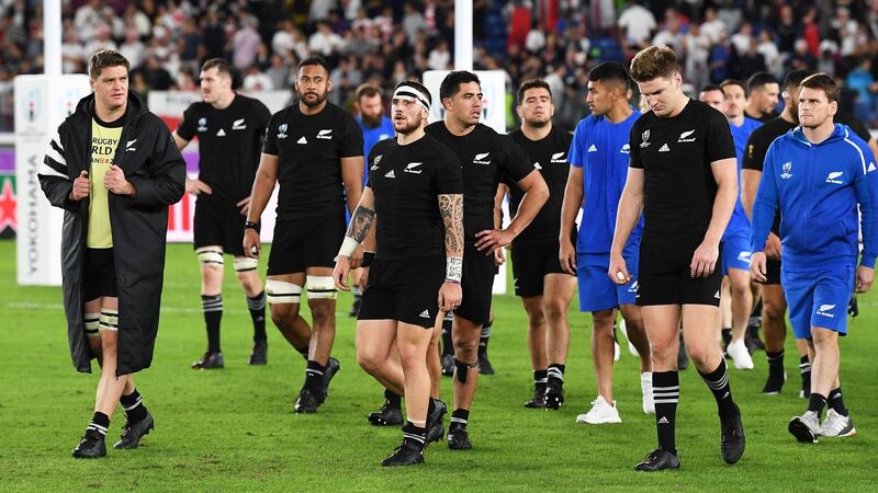 New Zealand players dejected after the final whistle after the defeat to England. Photograph: Andrew Cornaga/Inpho
