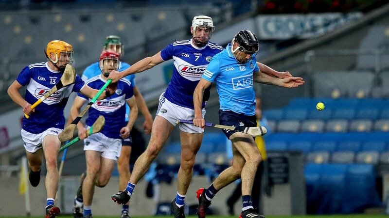 Dublin’s Danny Sutcliffe is challenged by Ryan Mullaney during his side’s win over Laois. Photograph: Ryan Byrne/Inpho