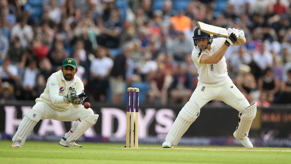England batsman Jos Buttler cuts a ball watched by wicketkeeper Sarfraz Ahmed during day two of the second test match between England and Pakistan at Headingley. Photo: Stu Forster/Getty Images