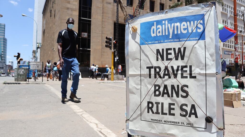 A daily newspaper poster reporting on the recently introduced travel bans  in Harare, Zimbabwe after the outbreak of the Omicron variant of coronavirus in South Africa and Botswana. Photograph: Aaron Ufumeli/EPA