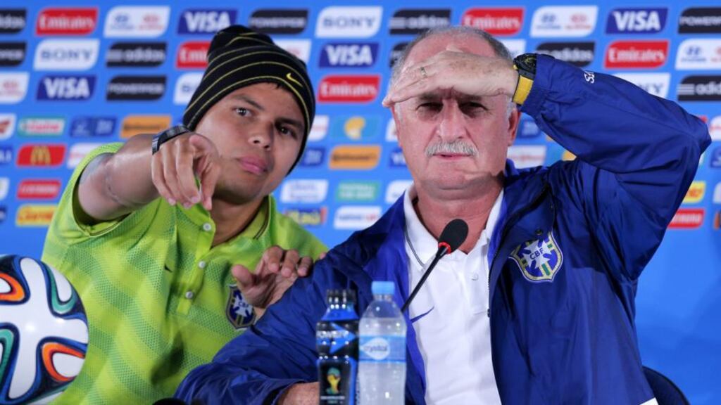 Brazil captain Thiago Silva (left) and coach Luiz Felipe Scolari (right) during a press conference at Estadio National in Brasilia. Photograph: Robert Ghement / EPA