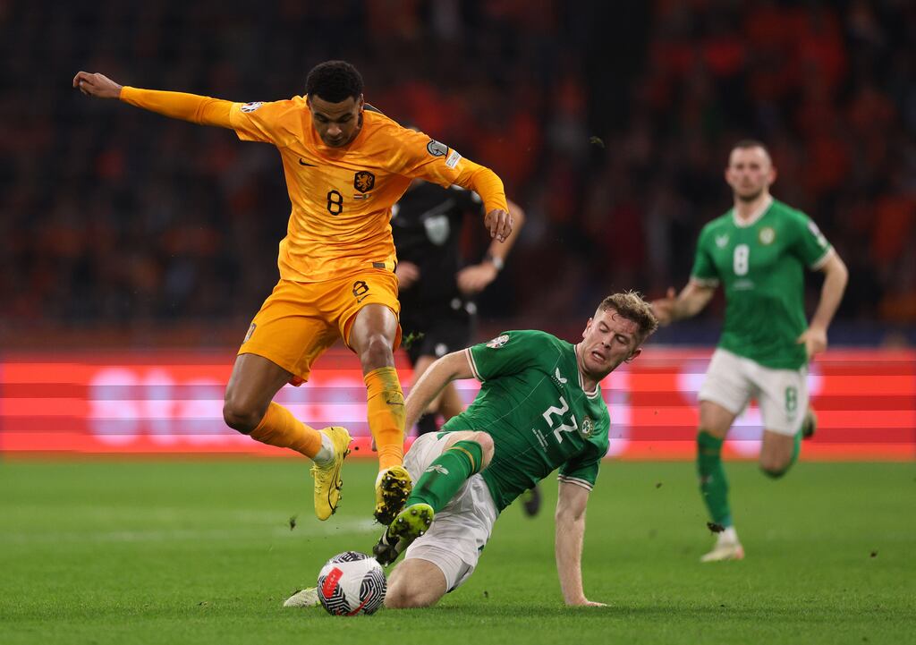 Cody Gakpo of the Netherlands is tackled by Nathan Collins of the Republic of Ireland during the Euro 2024 qualifier in Amsterdam. Photograph: Dean Mouhtaropoulos/Getty Images