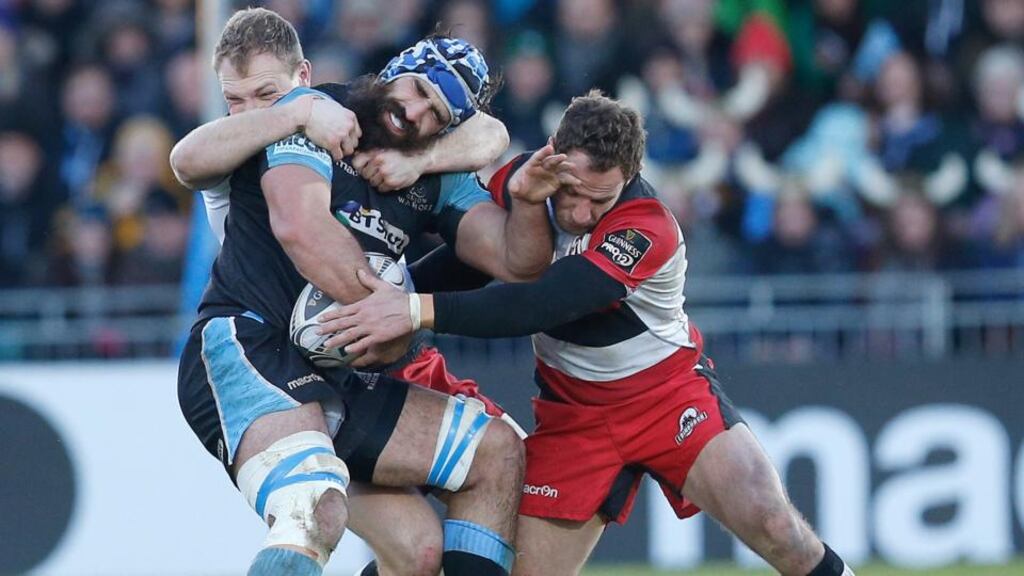 Josh Strauss of Glasgow Warriors is tackled by Edinburgh’s Greig Tonks and Andries Strauss at Scotstoun. Photograph: Russell Cheyne / Inpho