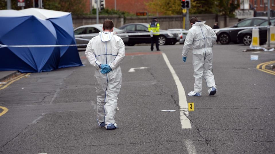 Garda forensic team members examine the Hanlon’s Corner area following a shooting in which four people were injured early this morning. Photograph: Eric Luke/The Irish Times