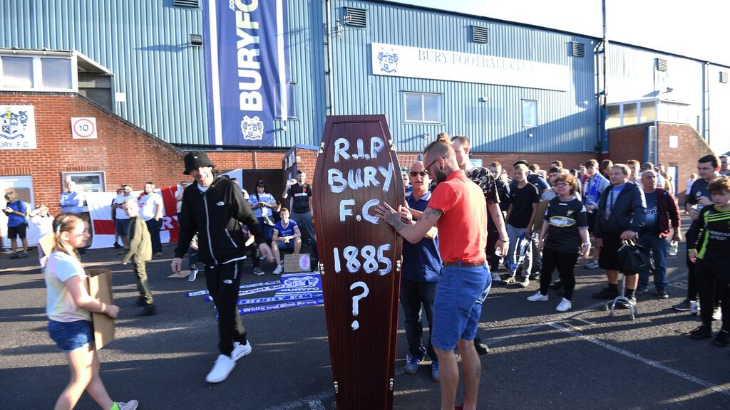 Supporters outside Bury FC’s Gigg Lane on Friday. Photograph: Facundo Arrizabalaga/EPA
