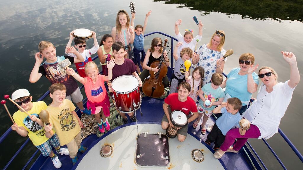 Cellist Norah O’Leary from Ensemble Dagda with students from St Brendan’s NS Bantry at the launch of the West Cork Chamber Music Festival in Bantry, Co Cork. Photograph: Darragh Kane