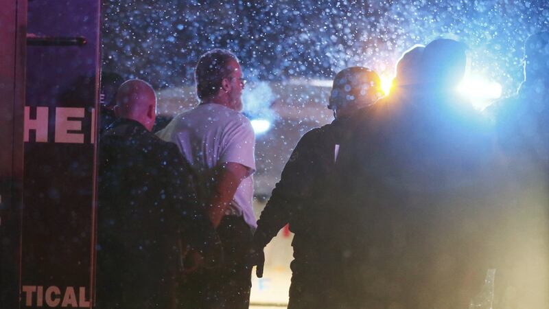 A suspect is taken into custody outside a Planned Parenthood centre in Colorado. Photograph: Isaiah Downing/Reuters