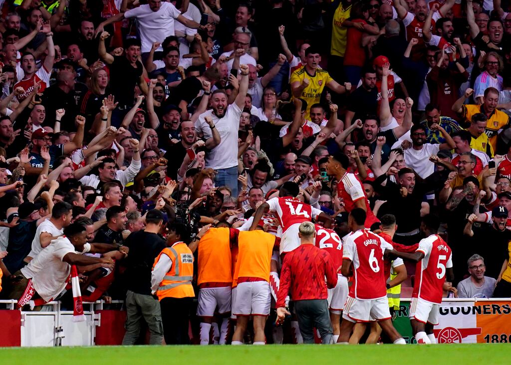 Arsenal players celebrate with their fans after Gabriel Martinelli scored the winning goal against Manchester City at the Emirates Stadium. Photograph: John Walton/PA