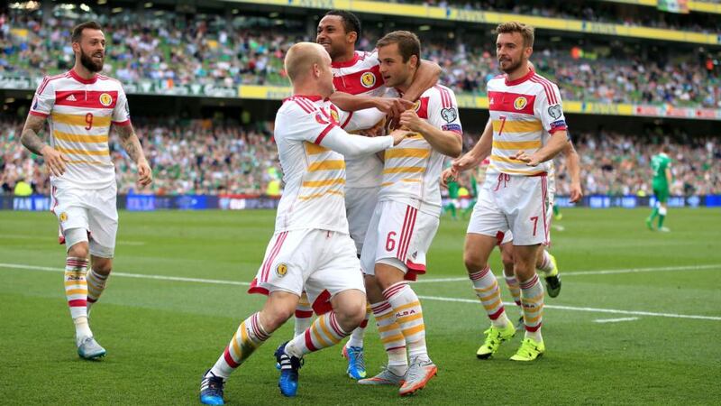 Scotland’s Shaun Maloney (number 6) celebrates with his team-mates after scoring the equalising goal in the Euro 2016 Group D qualifier against Republic of Ireland at the Aviva Stadium. Photo: Nick Potts/PA