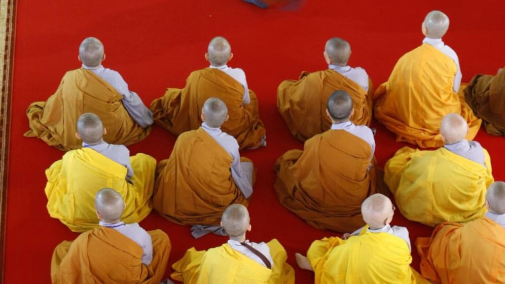Buddhist monks attend the blessing, by the Dalai Lama, of a new Buddhist temple  in  Paris. Photograph: Reuters
