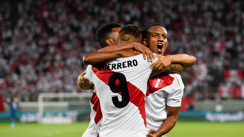 Andre Carillo (R) celebrates with Paulo Guerrero. Photograph: Gian Ehrenzeller/EPA