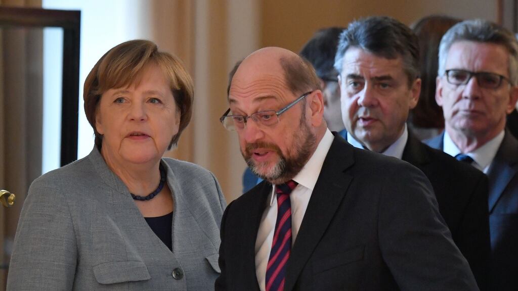German acting chancellor Angela Merkel and the leader of Germany’s social democratic SPD party Martin Schulz. Photograph: John MacDougall/AFP/Getty Images