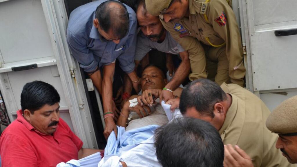 An injured policeman is rushed to a hospital for treatment after six people were killed in a raid on an Indian police station near the border with Pakistan. Photograph: Reuters