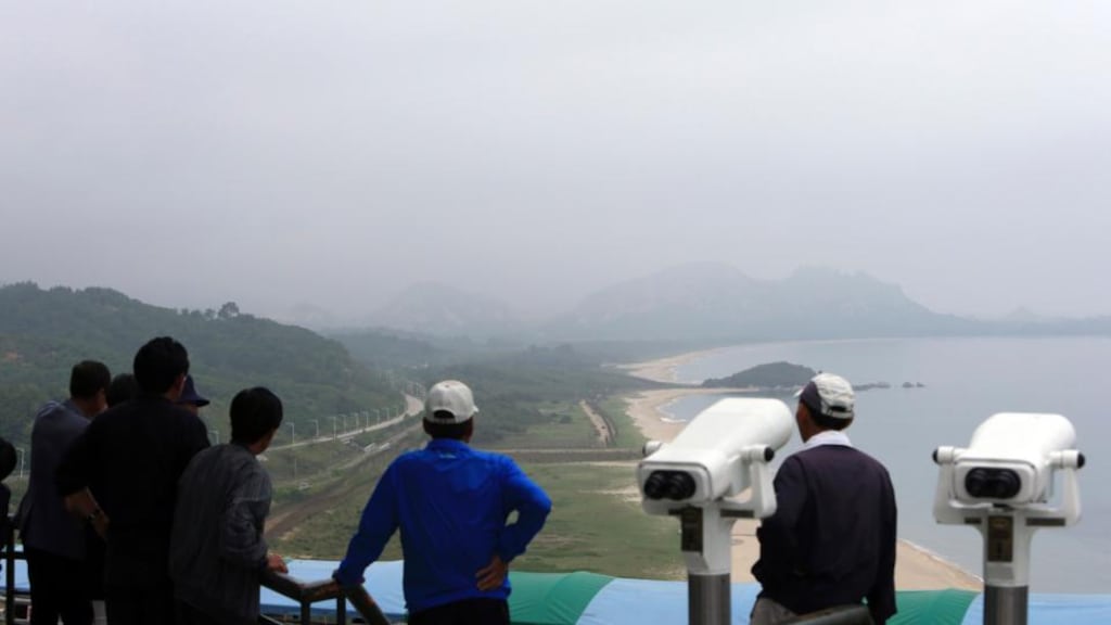 Visitors look to the North from a South Korean observation post, near the demilitarised zone separating the two Koreas in Goseong. Photograph: Lee Jong-gun/Yonhap/Reuters