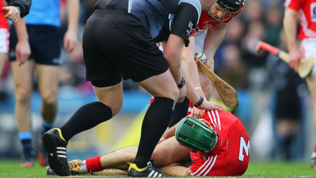 Referee Alan Kelly and Shane O’Neill check on Christopher Joyce after sustaining an injury which is now revealed to have been a cruciate ligamanet tear. Photograph: Cathal Noonan/Inpho