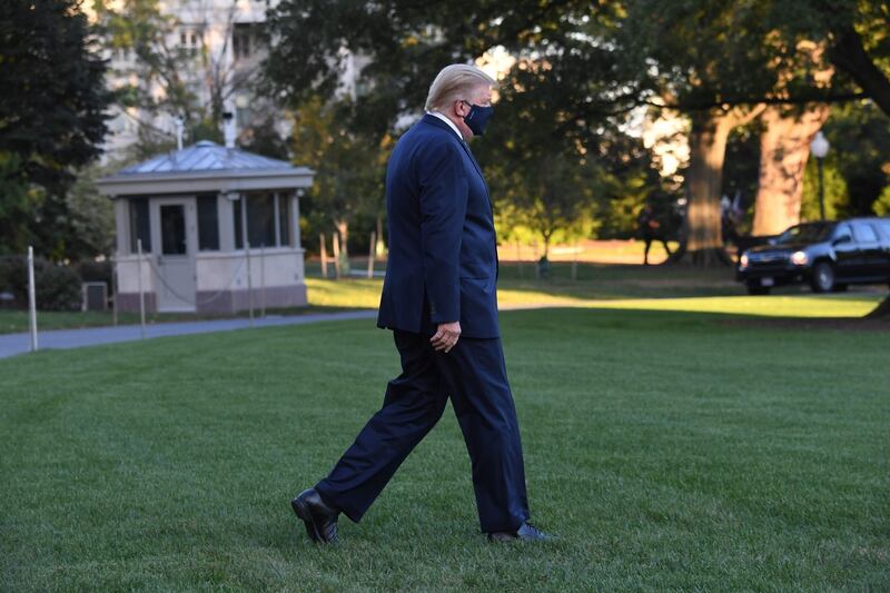 US president Donald Trump walks to Marine One prior to departure from the South Lawn of the White House in Washington DC as he heads to Walter Reed Military Medical Center after testing positive for Covid-19 on Friday. Photograph: Saul Loeb/AFP via Getty