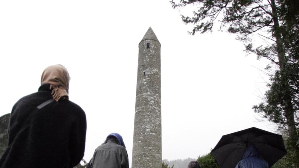 A round tower at Glendalough in Co Wicklow. A judge has directed that proceedings be brought against a county council boss seeking his attachment and possible committal to prison over an alleged breach of a High Court order linked to the location of snackfood outlets in a car park at the monastic site. Photograph: Cyril Byrne.