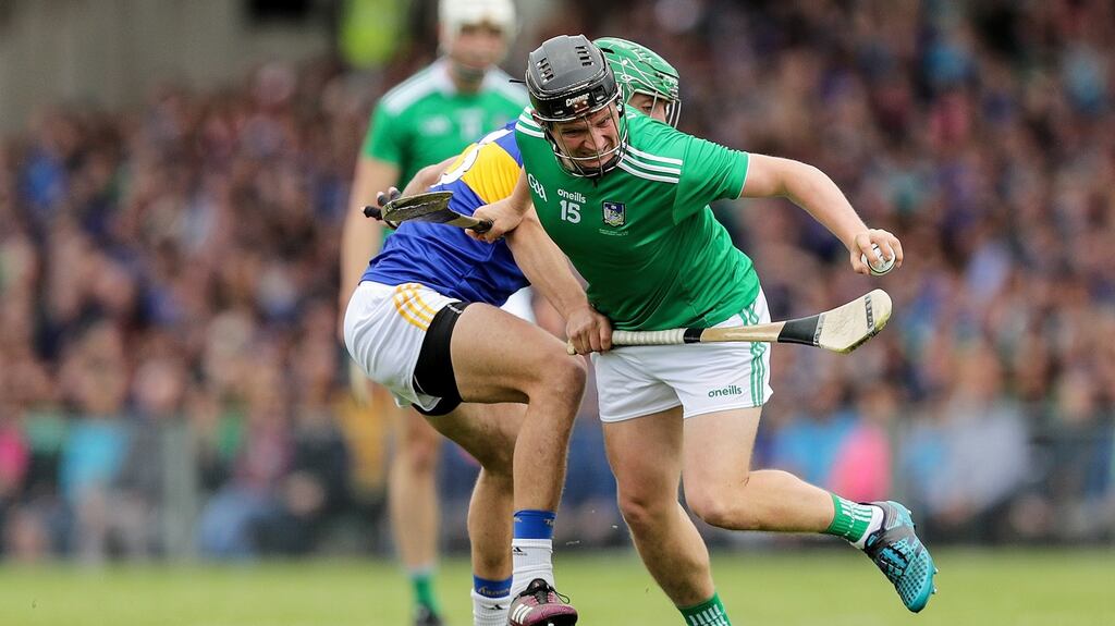Limerick’s Peter Casey and James Barry of Tipperary battle for possession during the Munster SHC final. Photo: Laszlo Geczo/Inpho