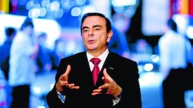 Nissan shakes up management as car-maker slashes profit outlook