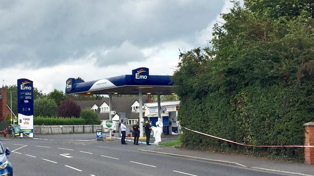 Forensics examining the scene outside a petrol station in Co Down where a murder investigation has begun. Photograph: David Young/PA Wire