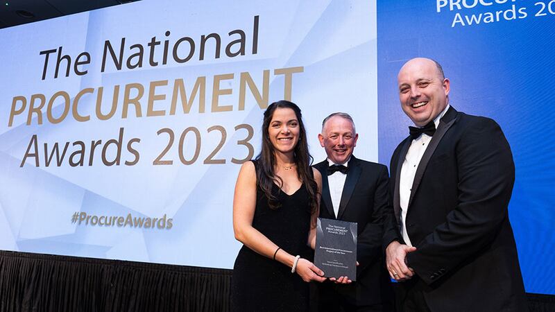 Robert Babington, awards judge, presents the best international procurement project of the year award to Robert Fitzmaurice and Lexy Staffurth, Primark