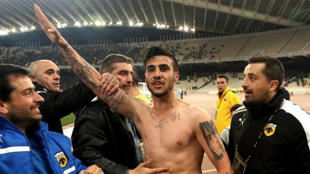 AEK Athens' Giorgos Katidis has been banned from the Greek national side for life for this celebration. Photograph: Giannis Liakos/Icon/Reuters