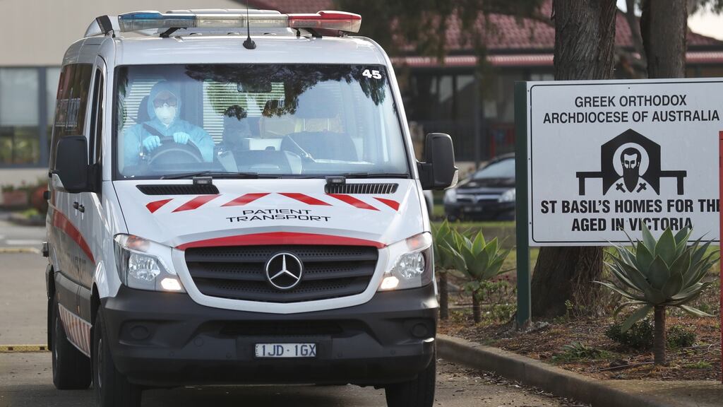 Medical staff prepare to transport people from the St Basil’s Home for the Aged which has had an outbreak of coronavirus disease, in Melbourne, Victoria. Photograph: EPA