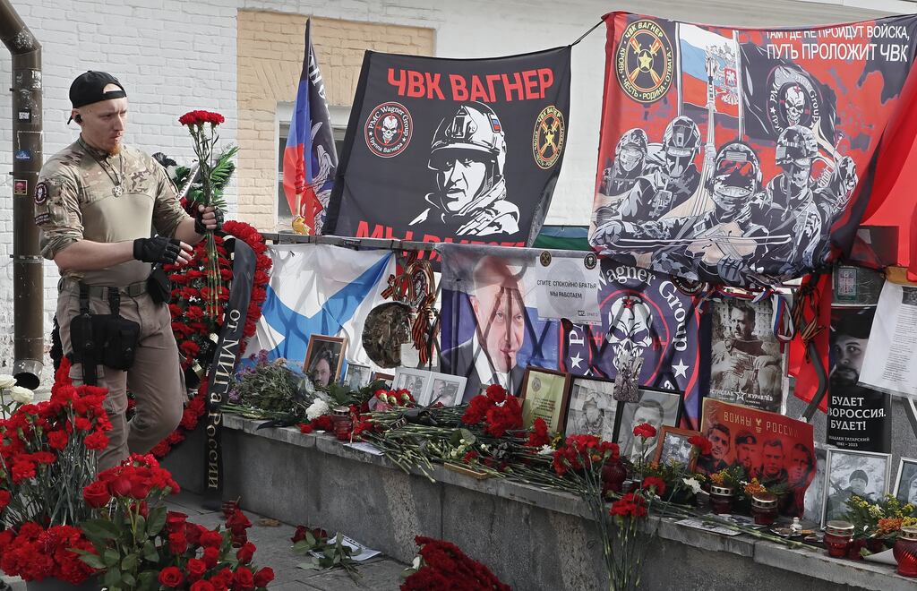 A man in military uniform pays tribute to Wagner Group's leader Yevgeny Prigozhin on the 40th day since his death, at an informal memorial near the Kremlin in Moscow on October 1st. Photograph: EPA
