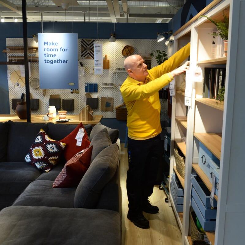 Ikea shift: Conor Pope arranges shelves in the Dublin store. Photograph: Dara Mac Dónail