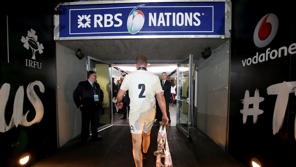 England captain Dylan Hartley heads to the dressingrooms with the Six Nations trophy. Photograph: Dan Sheridan/Inpho