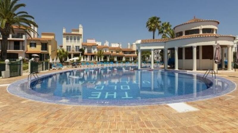 This duplex in the upscale Old Village complex in Vilamoura has a roof terrace.